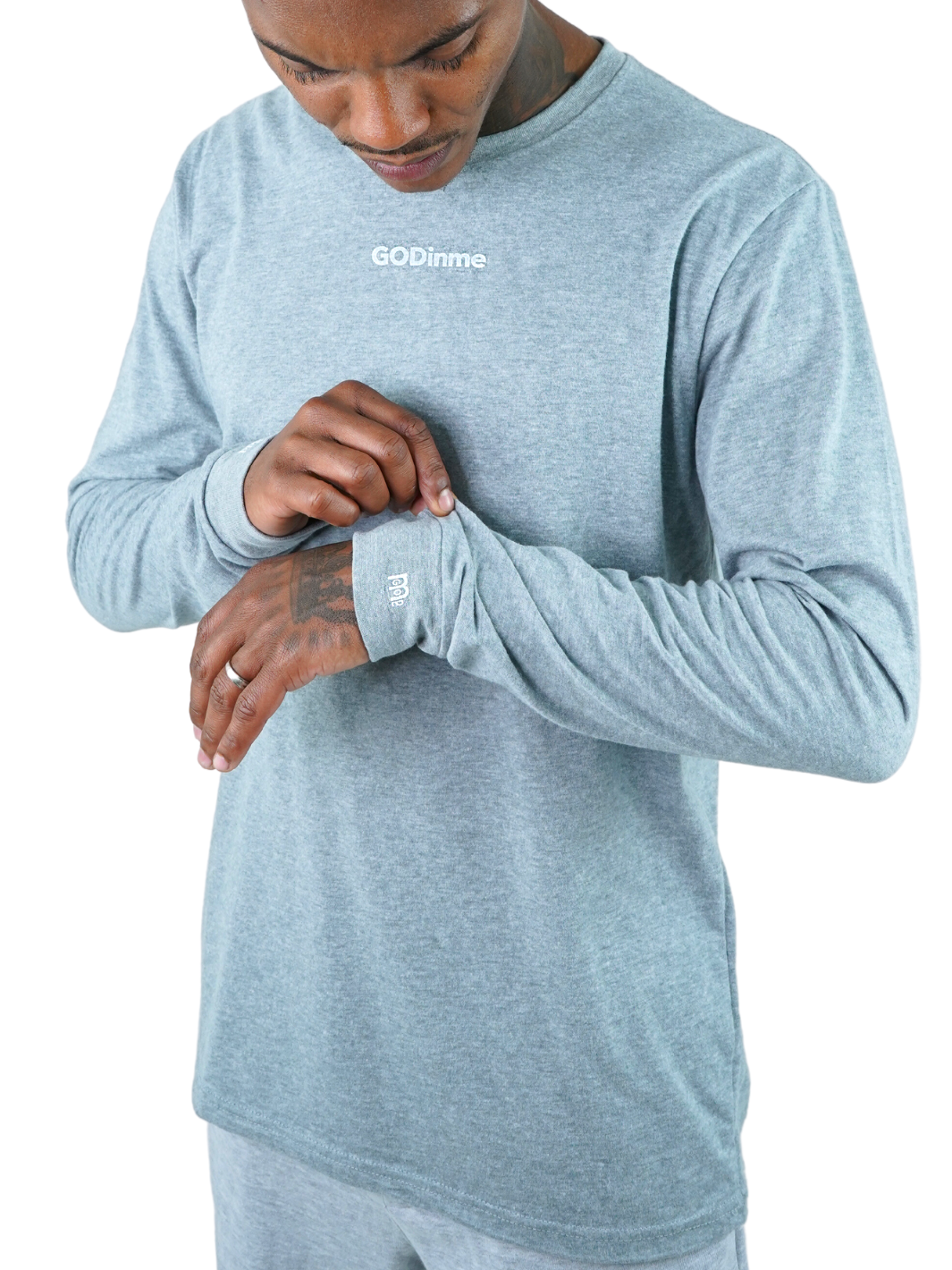 Made to feel like sueded peach fuzz, this Grey long sleeve shirt offers unbeatable comfort. The GODinme printed on front chest and the logo on sleeve cuffs and upper back represent boldness and style.