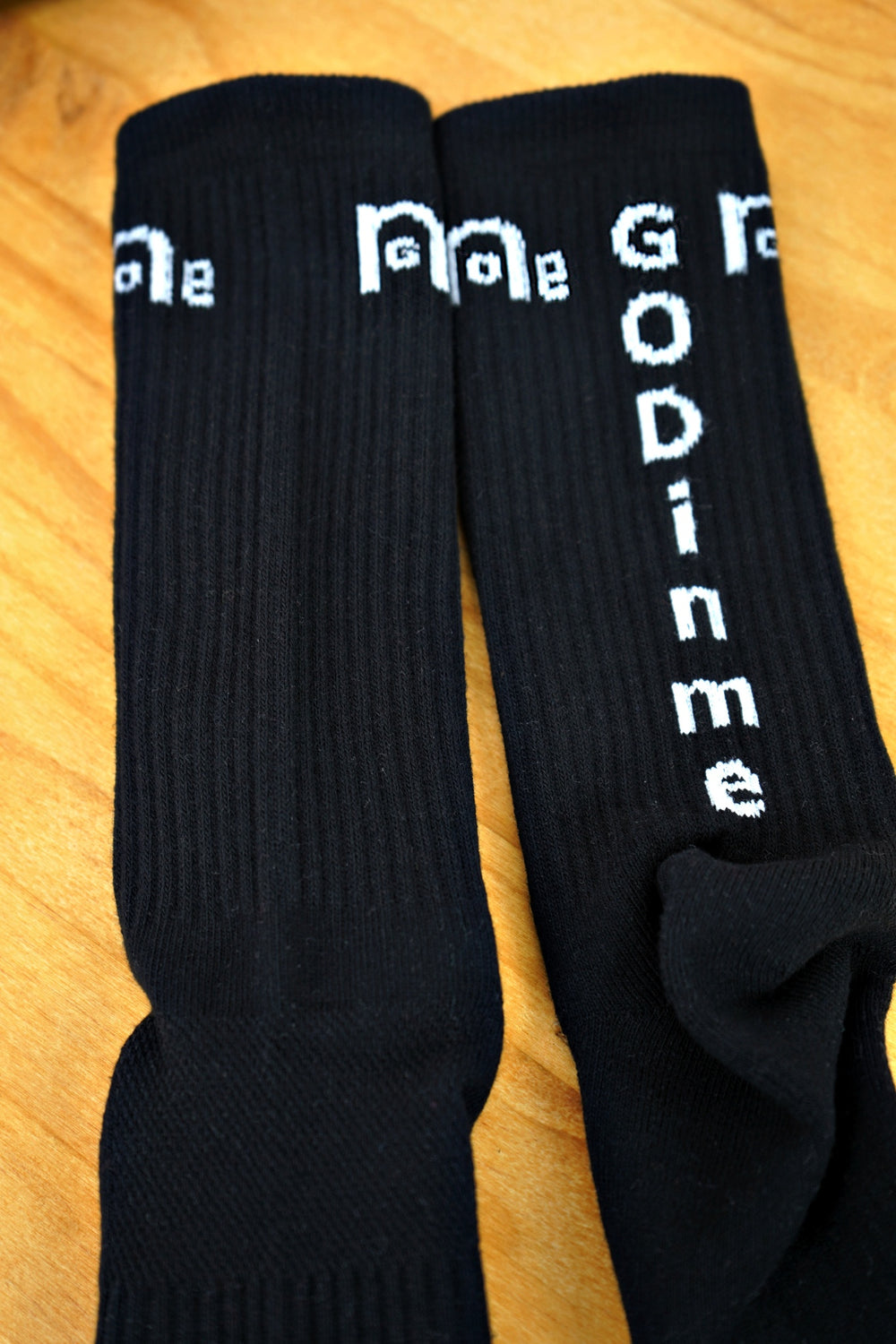 High quality Women's Black Athletic Socks are comfortable yet durable; featuring the empowering GODinme logo on each side, and GODinme name at toes and back achilles area to give you the confidence and motivation to reach your fitness goals.