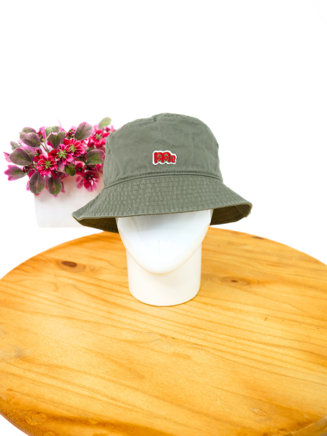 Represent your timeless style with this Olive Green GODinme Bucket Hat featuring GODinme brand name and logo embroidered in Red