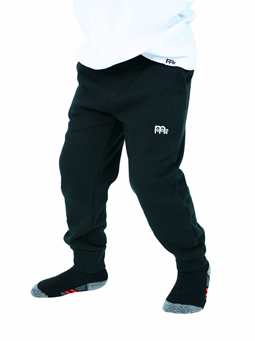 Toddler size Black jogger Sweatpants with elastic waistband, sewn fly detail, jersey-lined front pockets, stylish back pocket, and White GODinme logo.