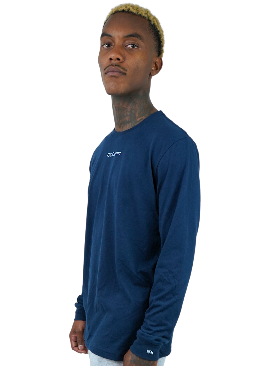 Side view of classic-fit navy blue GODinme long sleeve shirt on model.