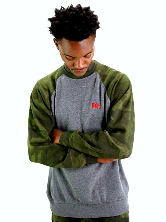 Model wearing a GODinme Crewneck Sweater with Grey body, Green Camouflage raglan sleeves, and embroidered Red GODinme logo at left chest.