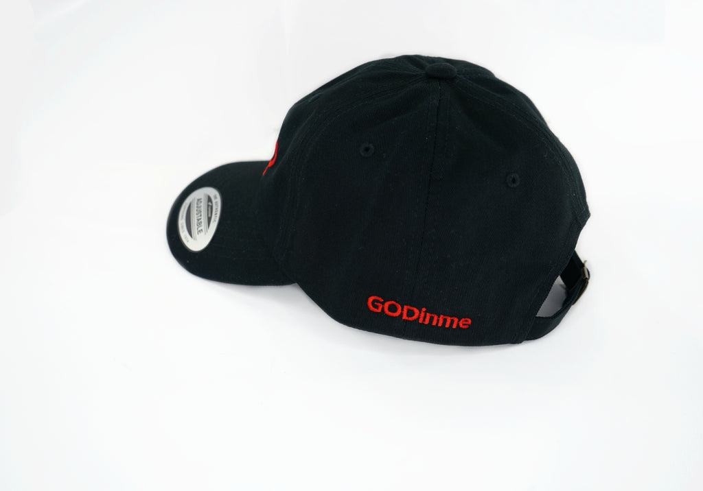 The forever popular Black 6 panel unstructured Dad Hat has Black curved under visor and antique Brass buckle closure. Embroidered in Red is the GODinme Logo on front and GODinme name on left side.