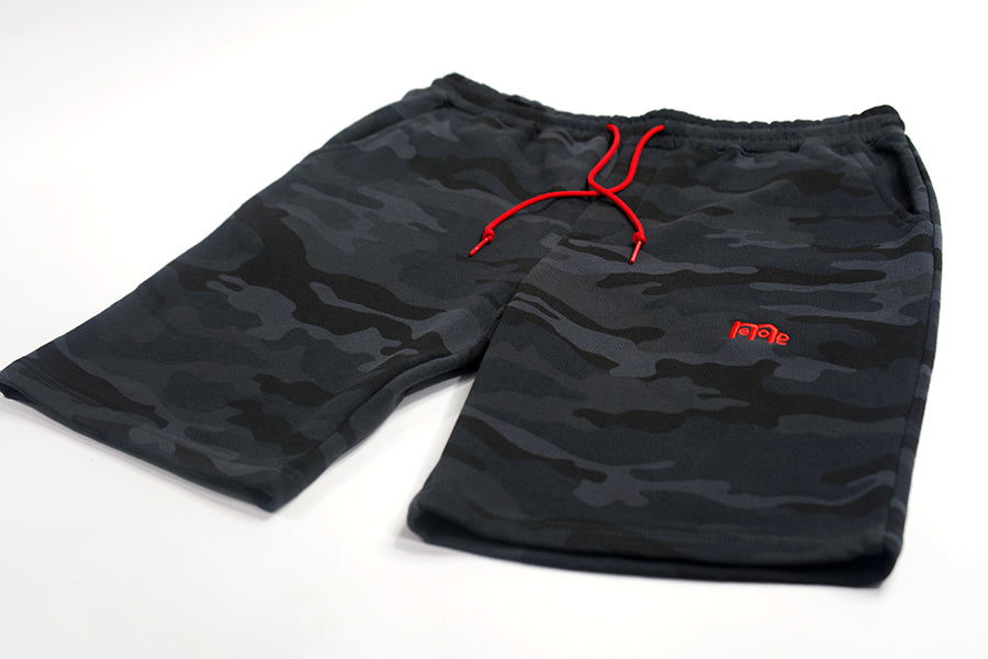 These actively casual GODinme shorts come in a Black or Green Camouflage design. Complete with a bold embroidered logo and a shoestring draw cord in Red to make a faithful statement wherever you go.