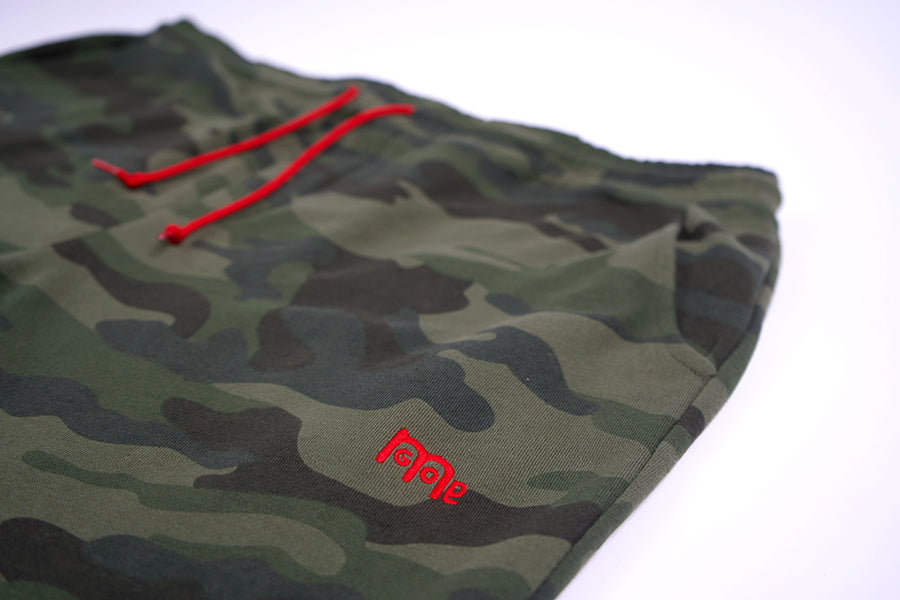 These actively casual GODinme shorts come in a Black or Green Camouflage design. Complete with a bold embroidered logo and a shoestring draw cord in Red to make a faithful statement wherever you go.