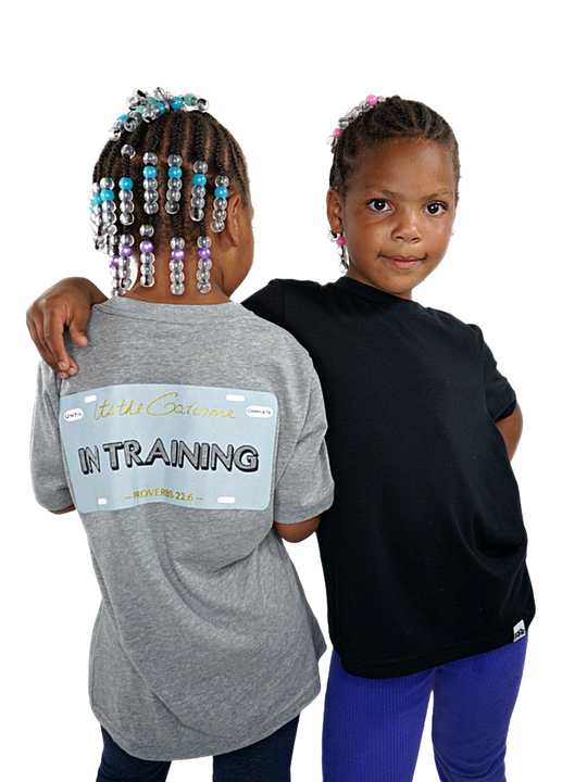 Grey T-shirt with "In Training" and Proverbs 22:6 printed within license plate design on back and woven GODinme tag attached to  bottom front .
