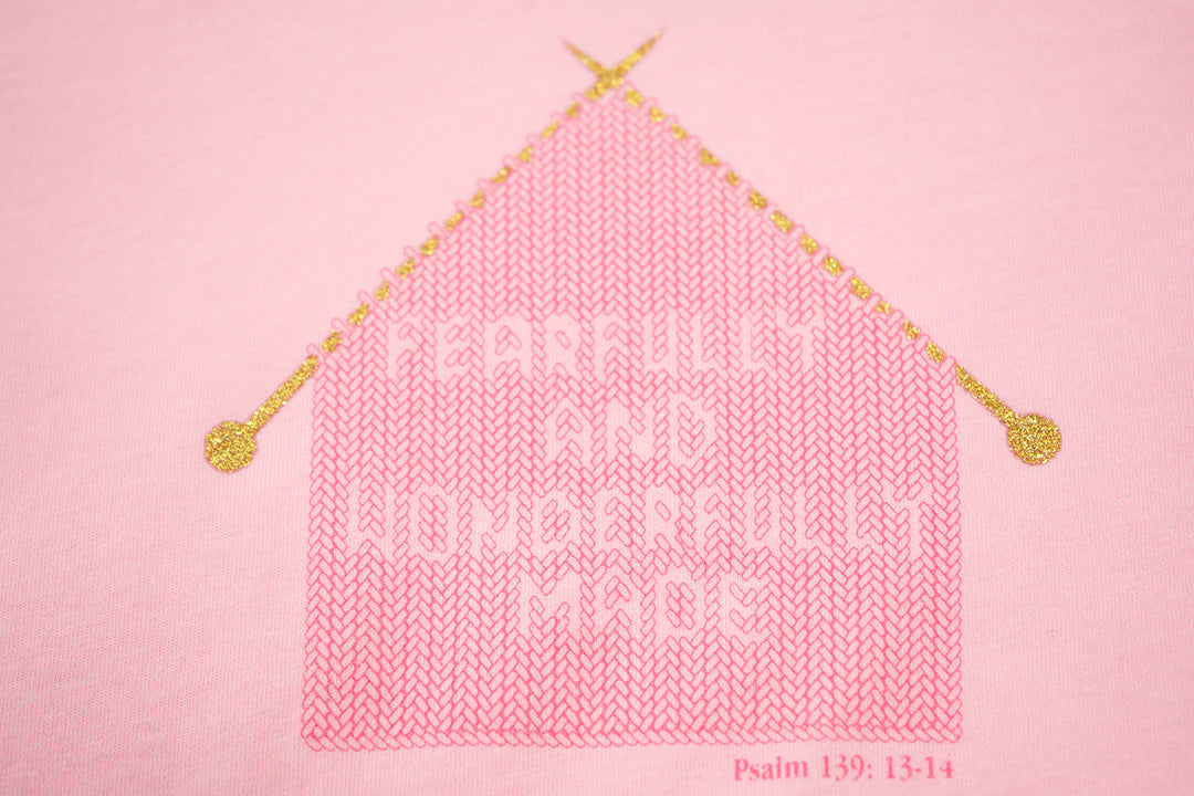 Pink Toddler T-Shirt with "Fearfully and Wonderfully Made" printed on front and woven GODinme logo tag sewn at bottom left